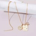cancer-zodiac-necklace-diamond-pendants-styled-editorial.jpg