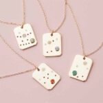 zodiac-charm-necklaces-styled.jpg
